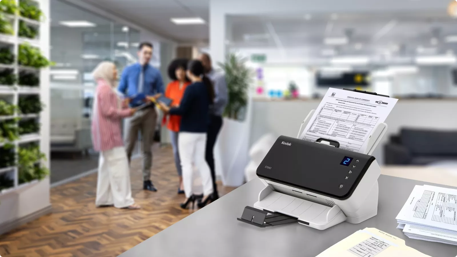 KODAK E1000 Scanner in office setting